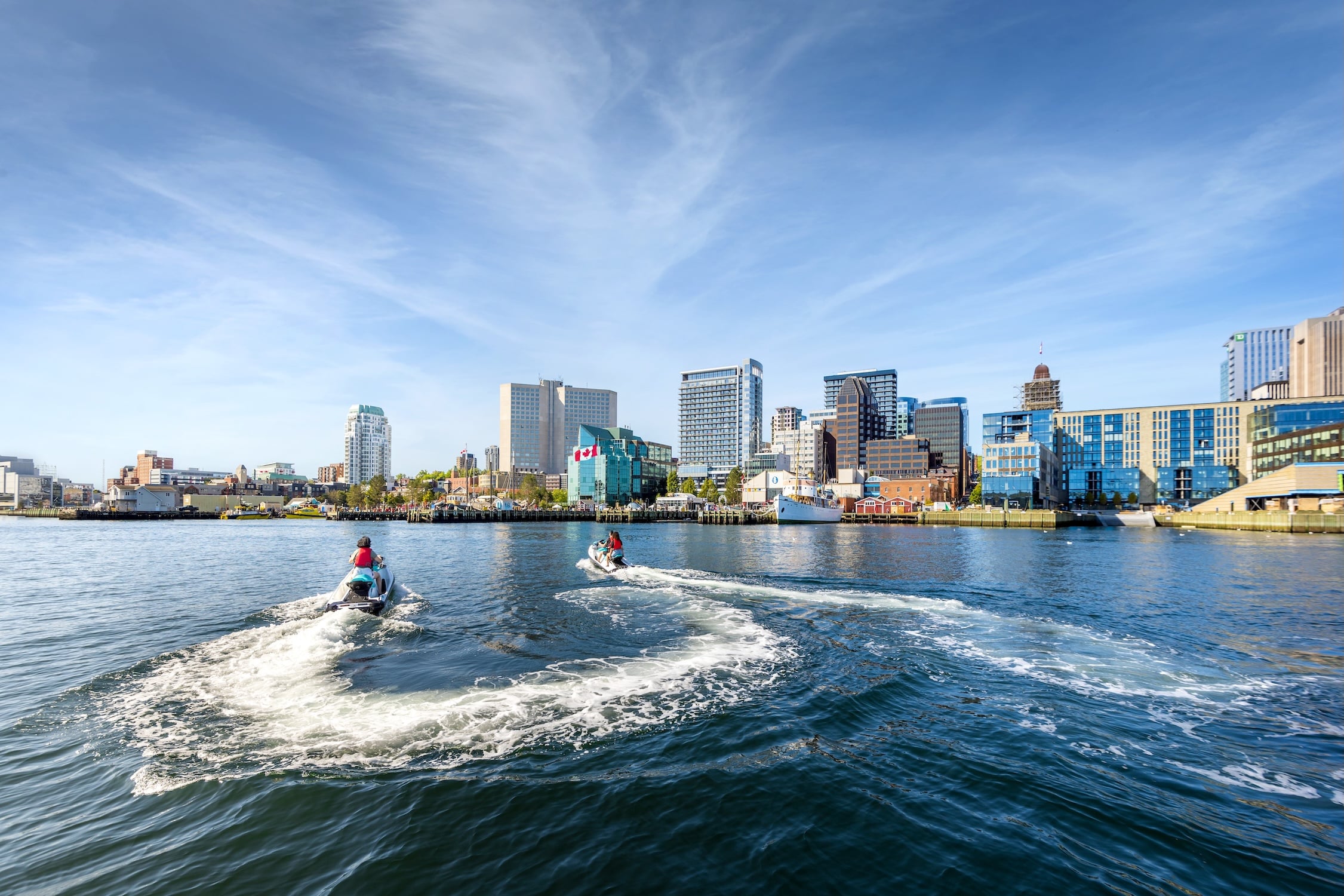 Two jet skis explore the Halifax Harbour on a warm sunny day