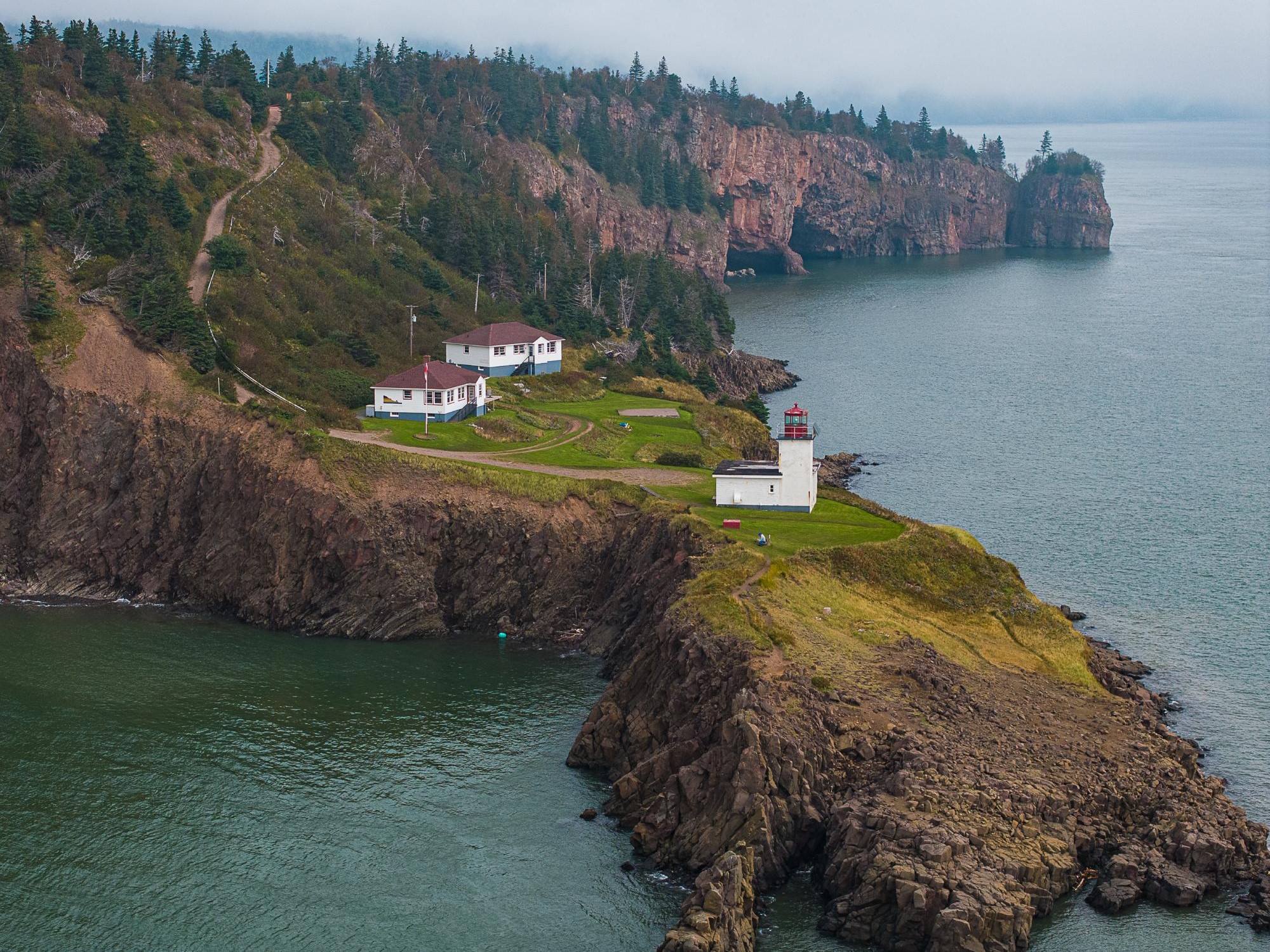 Cape D'or Lighthouse sits on the edge of cliffs along the Bay of Fundy.