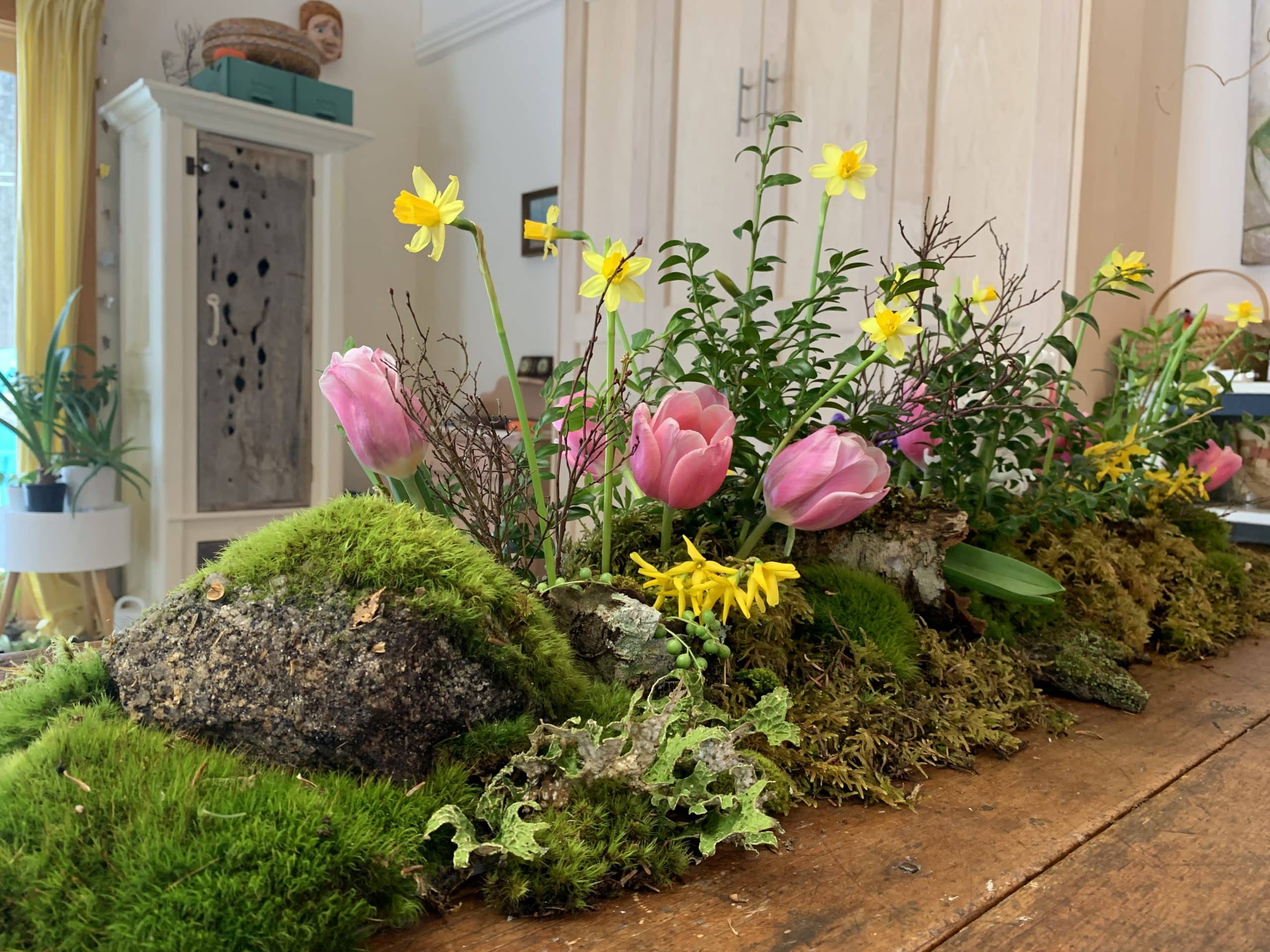 A closeup of a handmade moss garden.