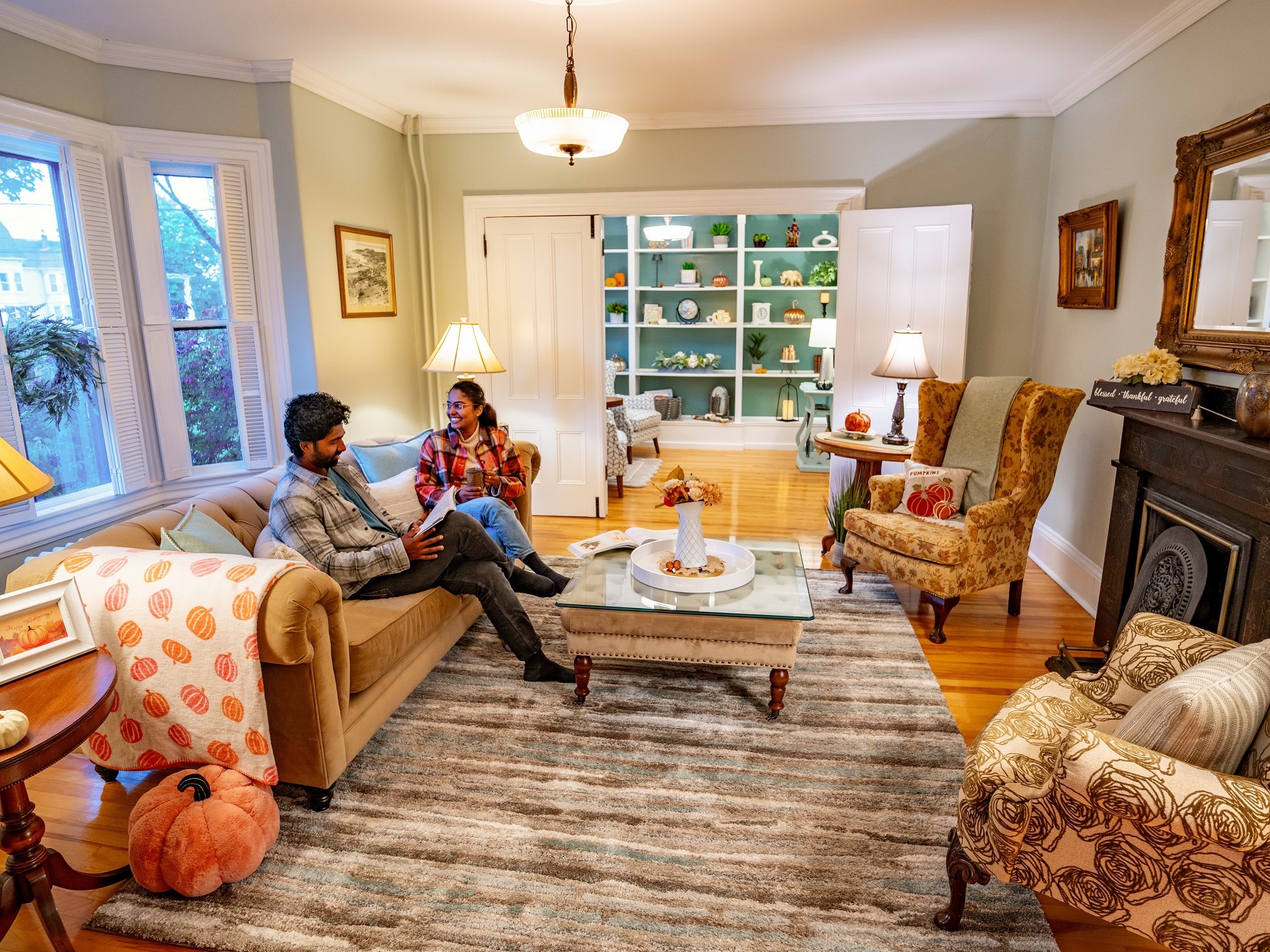 Two people sitting in a cozy lounge at Gillespie House Inn
