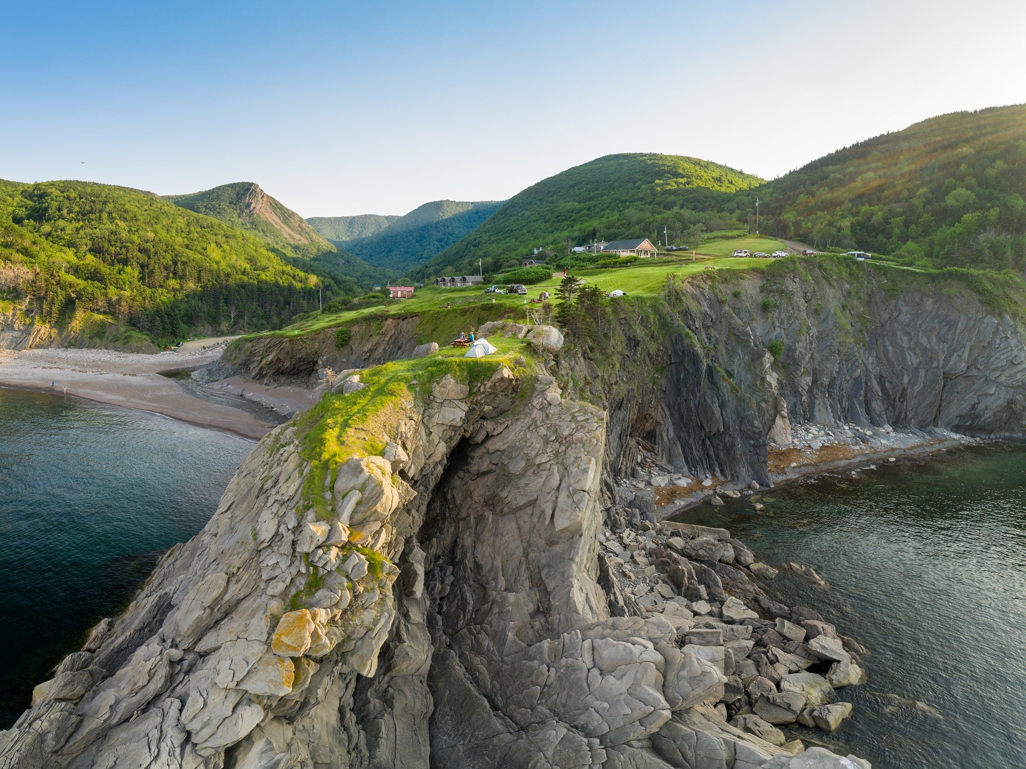 A campground perched on the edge of a rocky cliff.