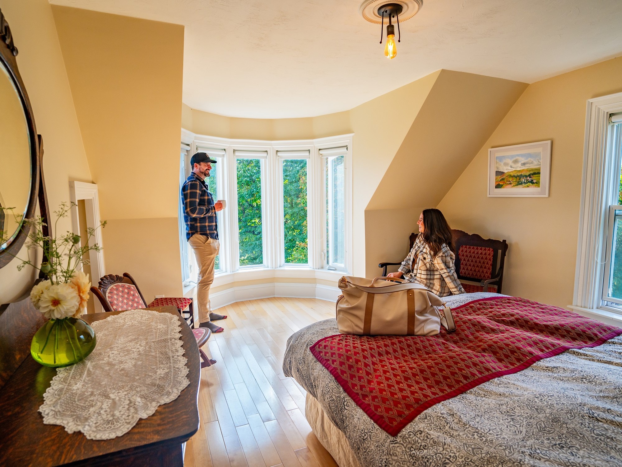 A couple relaxes in a room at NovaShores Guest Room