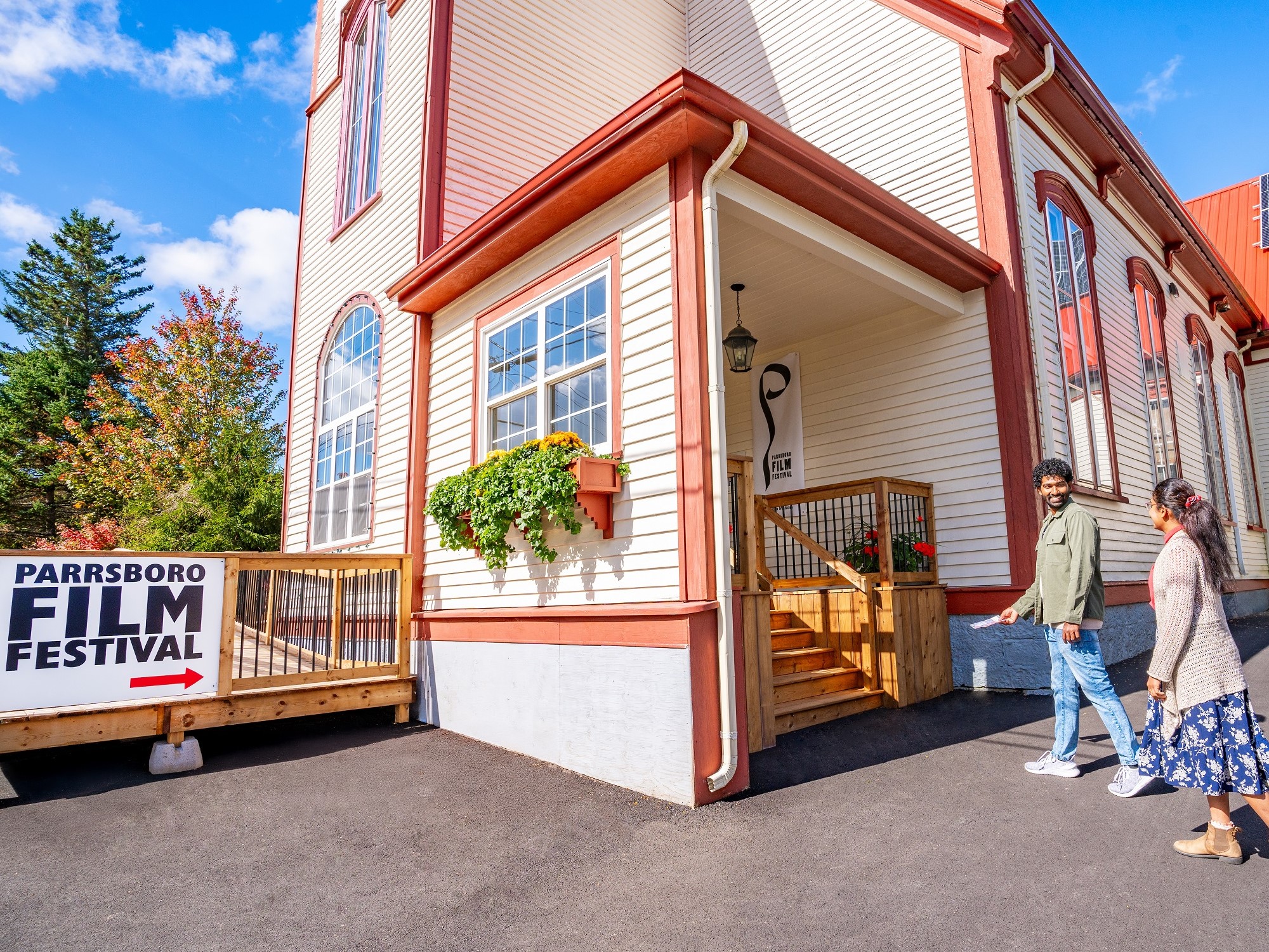 Two people enter a building for the Parrsboro Film Festival