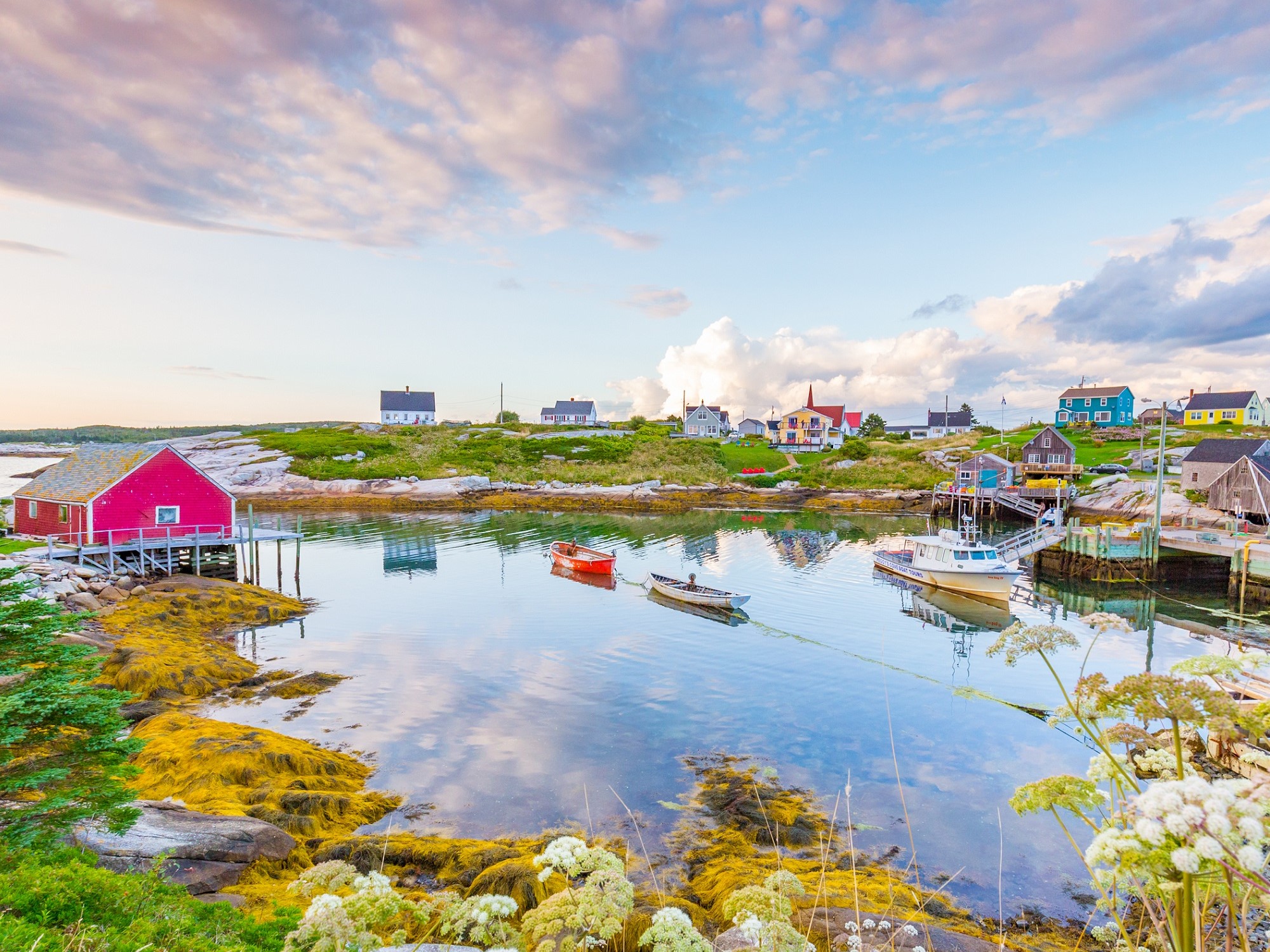 A colourful fishing village next to the ocean.