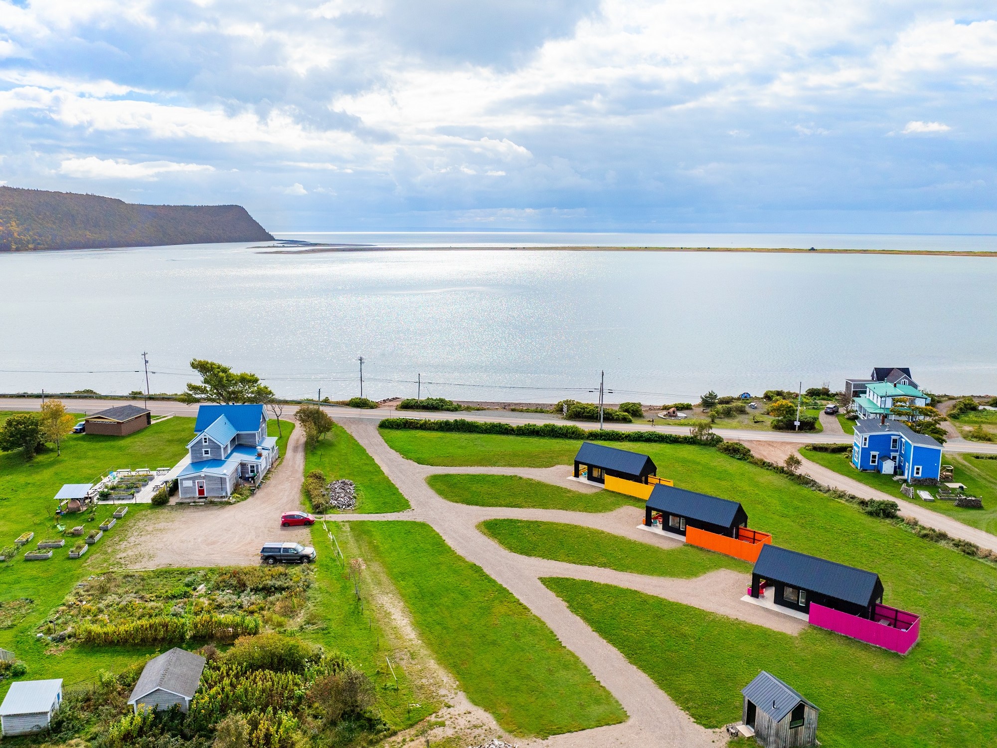 An aerial view of colourful cabins at Wild Caraway.