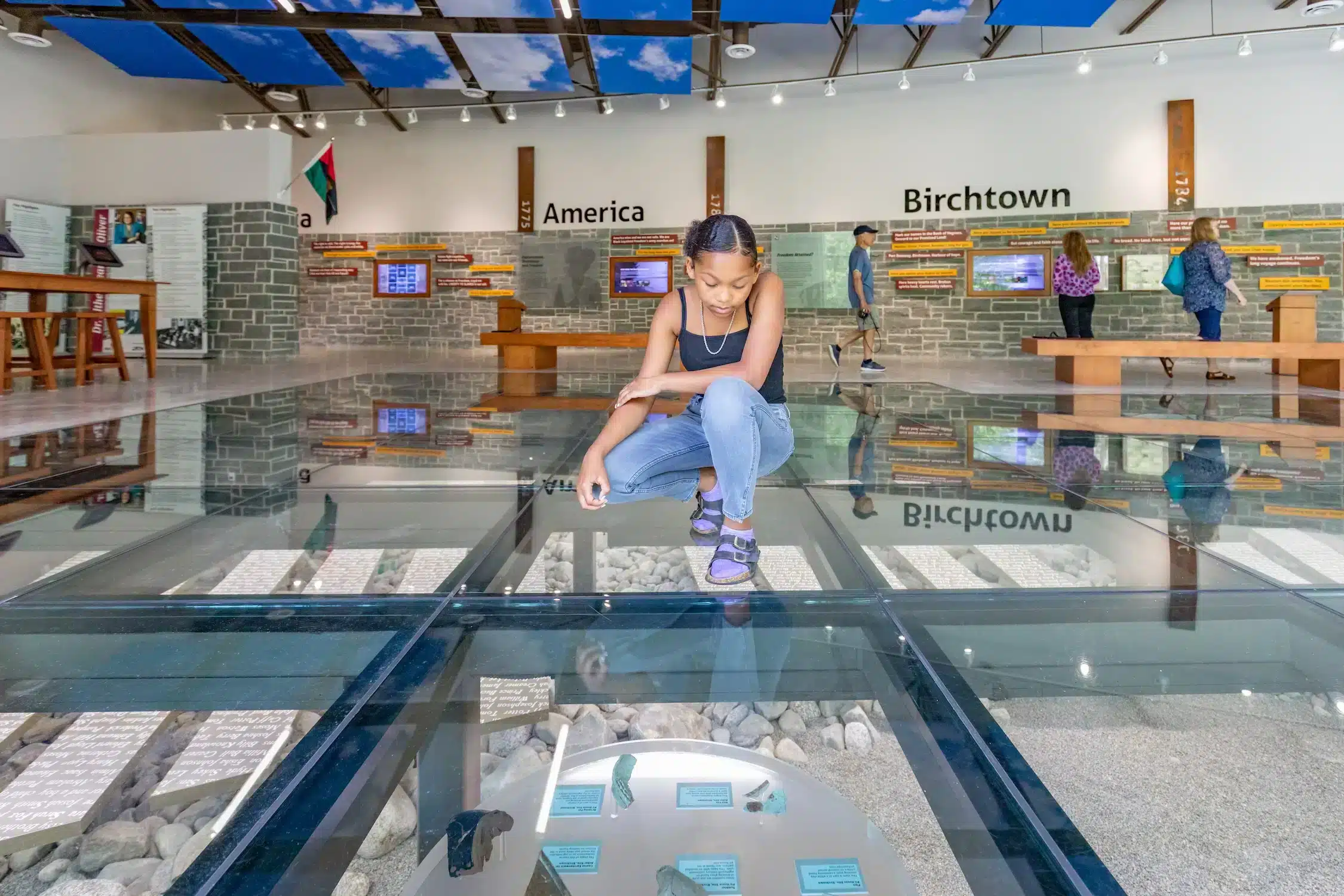 A young girl looking at a cultural display