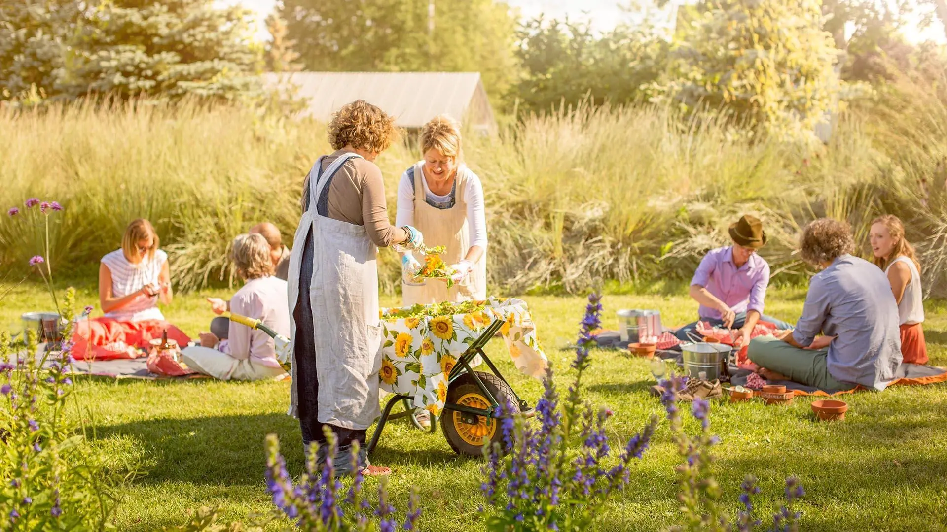 Participants enjoying a picnic lunch within the gardens at Tangled Garden in Grand Pre, Nova Scotia